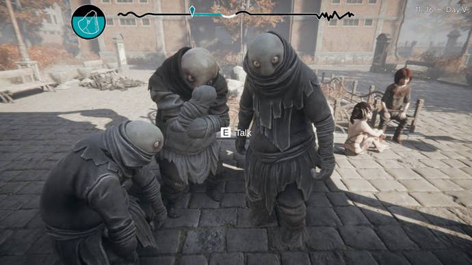 The three companions stand in front of the player on the street.