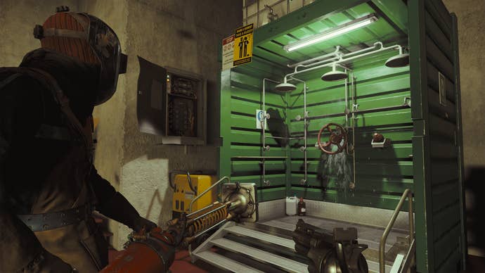A player in a standing cover next to a green detoxification room in the fire