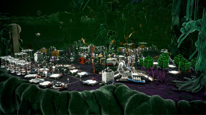 A microtopia factory includes trails and buildings in a green area.