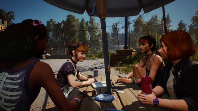 Four friends around a picnic table in the lost file: Bloom & Rage.