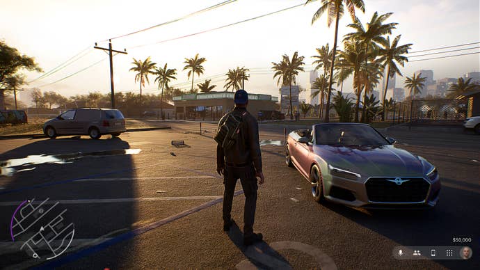 The player stood in a parking lot next to a sports car when the sun set on the palm trees from afar.