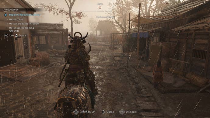 Yasuke on the horse's back passed through a town street in the rain.