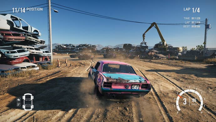 The pink and blue car of the player drifted around a dust corner in a shattered factory.